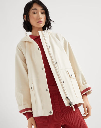 Water-resistant cotton canvas hooded outerwear jacket with heat-bonded seams and shiny zipper pull